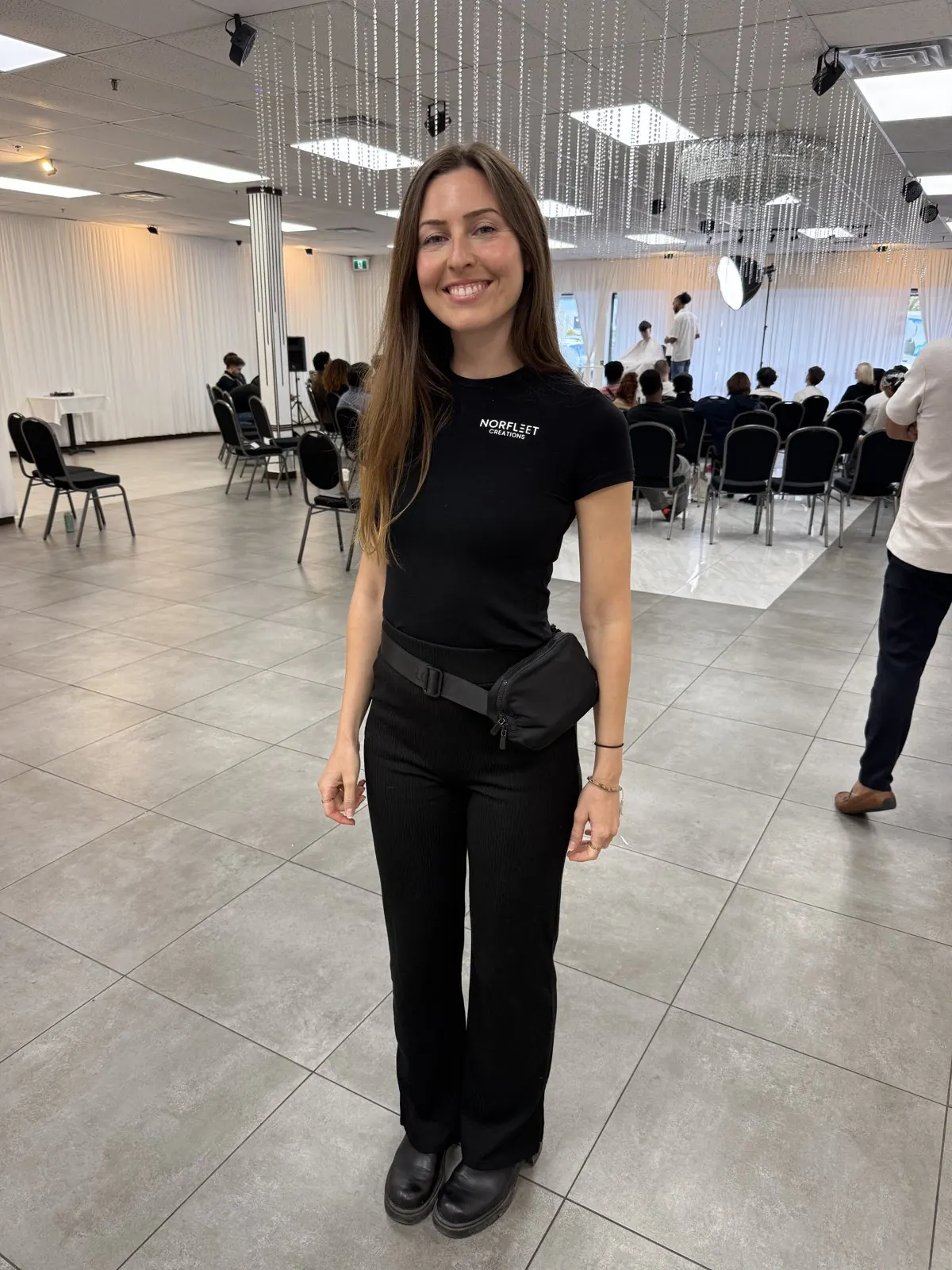 Roxanne in a Norfleet Créations shirt at a production